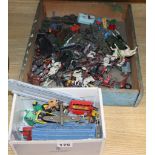 A quantity of farmyard animals and toy cars