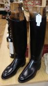A pair of black leather riding boots, the trees bearing ivorine plaques inscribed 'Viscount