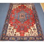 A Persian red ground rug 207 x 134cm