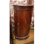 A mahogany bow fronted corner hanging cabinet W.42cm