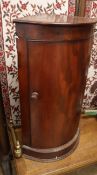 A mahogany bow fronted corner hanging cabinet W.42cm
