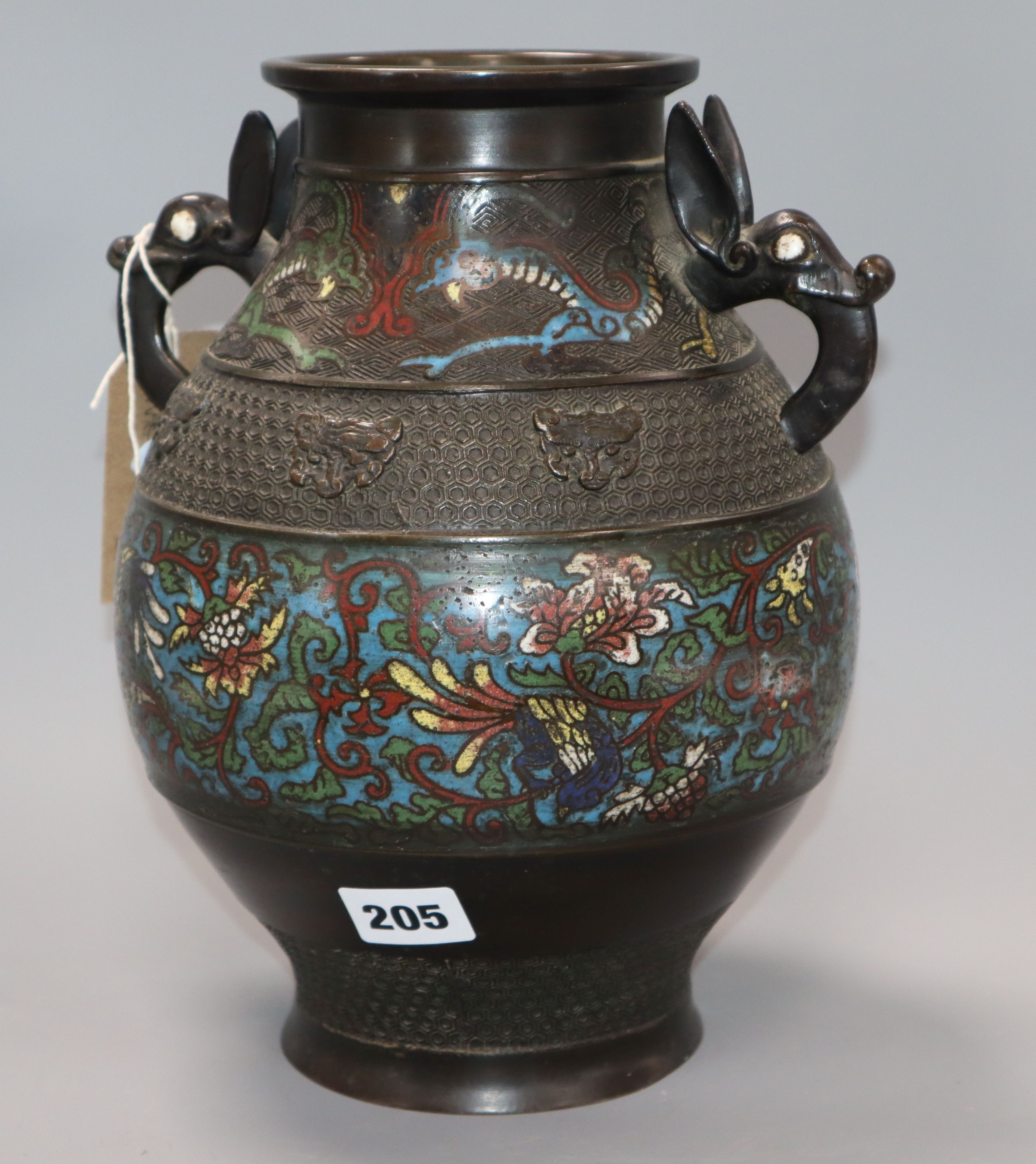 An Oriental bronze two handled champleve enamel vase