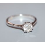 An 18ct white metal and solitaire diamond ring, size M.