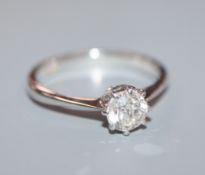 An 18ct white metal and solitaire diamond ring, size M.