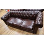 A three seater bown leather Chesterfield settee W.200cm