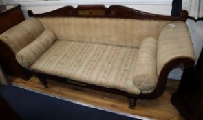 A Regency brass inlaid rosewood scroll arm settee