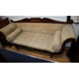 A Regency brass inlaid rosewood scroll arm settee