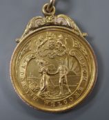 A 9ct gold 'Lydney's Welcome Home' medallion to J. Watts, hallmarked for Birmingham, 1918, 10.6