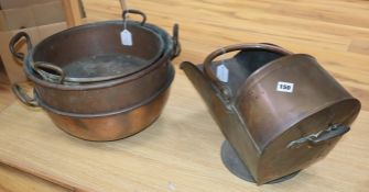 Three Victorian copper preserve pans and a Victorian copper coal helmet (4)