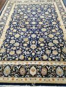 A Kashan blue ground carpet 330 x 236cm