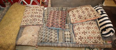 Nine Kelim covered cushions and an embroidered panel