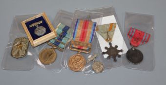 Six World War II Japanese medals and a Japanese Naval badge