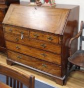 A Georgian mahogany bureau, with fitted interior over two drawers and three long drawers W.112cm