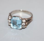 A white metal, aquamarine and white sapphire? set dress ring, size O.