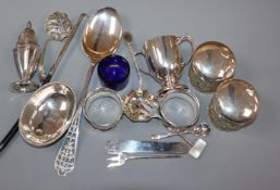 A group of sundry small silver, including a pepperette, napkin rings, sifter spoons etc.