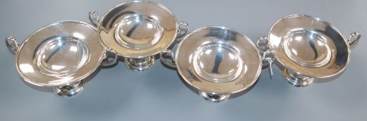 A set of four Edwardian silver two handled pedestal small dishes, London, 1903, height 9cm, 20.5