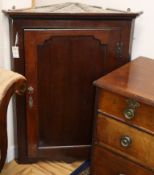 A George III mahogany hanging corner cabinet W.78cm