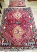 Two North West Persian style red ground rugs largest 170 x 124cm