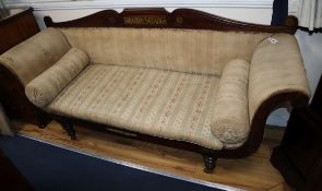 A Regency brass inlaid rosewood scroll arm settee