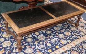 A leather inset walnut coffee table W.130cm