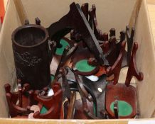 A quantity of hardwood plate stands and a bamboo brush pot