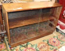 A mid century glazed low bookcase W.107cm