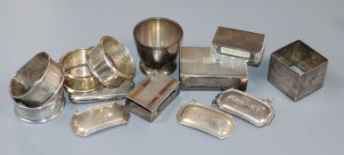 Four assorted silver match sleeves, five assorted silver napkin rings, three silver modern wine