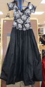 A black 1950's lace and pleated silk evening dress