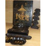 A late 19th century japanned papier mache desk set and a brass wheatsheaf letter rack