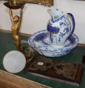 A brass and walnut book slide, An Art Deco lady lamp and blue and white jug and basin set.