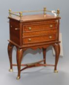 A mahogany and brass music box modelled as a miniature cabinet and another