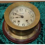 A brass bulkhead clock