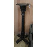 A Victorian carved oak torchere H.128cm