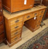 A late Victorian oak kneehole desk W.120cm