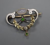 An early 20th century yellow and white metal, moonstone, diamond, enamel and demantoid garnet set