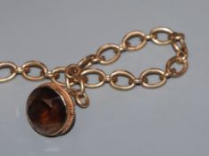 A 9ct gold bracelet with 9ct gold gem set fob, approx. 20cm.