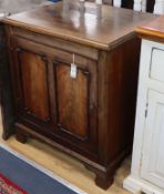 A Georgian mahogany cupboard fitted single panelled door, on bracket feet W.73cm