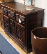 A Spanish carved oak buffet W.126cm