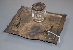 An Edwardian silver inkstand, with pen rest and single well, William Hutton & Sons, Ltd, Birmingham,