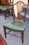 A set of eight Georgian Hepplewhite style shield-back mahogany dining chairs (two having arms)