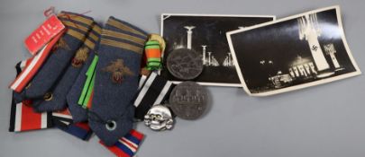 Assortment of German Badges two postcards and World War II RAF epaulettes and medal ribbons