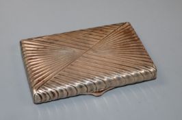 A late 19th/early 20th century Russian fluted white metal cigarette box, with hinged vesta