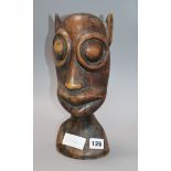 A tribal carved hardwood bust height 30cm