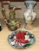 A Palissy lizard and vine ewer, a Palissy style crab plate and a maiolica style vase tallest 39cm