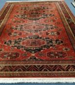 A Caucasian design red ground carpet 366 x 270cm