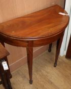 A George III style inlaid mahogany 'D' shaped folding tea table W.80cm