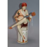 A Royal Dux figure of a lady playing a banjo height 28cm