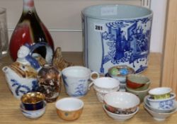 A quantity of Chinese and other porcelain including tea bowls, a bottle vase and a large blue and