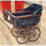 A decorative doll's pram height 50cm