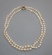 A double strand cultured pearl choker necklace with 9ct gem set clasp, 35cm.